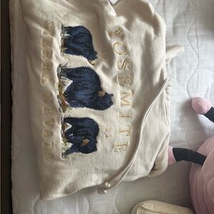 Brandy Melville Cream Hoodie with Blue Bear Design